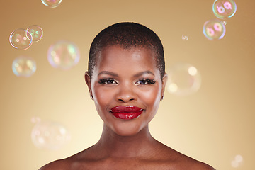 Image showing Beauty, makeup and bubbles with portrait of black woman in studio for cosmetics, spa treatment and luxury. Skincare, dermatology and self care with model on gold background for glow, facial and soap