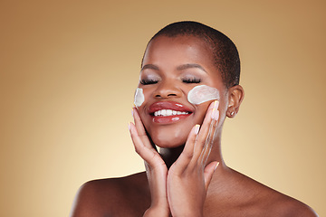 Image showing Happy, skincare and black woman with face cream in studio for makeup removal and wellness on brown background. Facial, cleaning and model with moisturizer, exfoliate or beauty, dermatology or mask