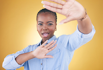 Image showing Fashion, hands frame and portrait of black woman in studio for confident, style or beauty. Photography, perspective and face of African person on yellow background in cosmetics, makeup and creativity