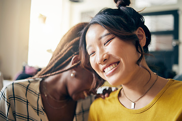 Image showing Happy, laughing and lesbian couple talking at their home with a funny or comedy joke. Happiness, love and interracial lgbtq women with a smile for bonding in the living room of their modern apartment