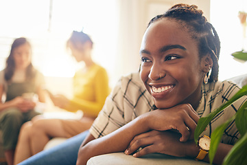 Image showing Happy, thinking and black woman relaxing in the living room with her friends in modern apartment. Happiness, positive and young African female person dreaming and sitting in lounge for rest at home.