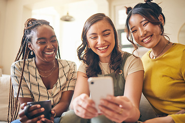 Image showing Young women, comedy online and smartphone, friends relax at home with social media and communication. Gen z, happiness and funny meme, chat and using phone with people on couch, mobile app and tech