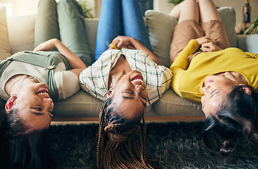 Image showing Upside down, friends and relax on sofa together with head hanging on couch and smile with happiness in home on weekend. Group, diversity and women laughing in fun, bonding or laying on chair in house