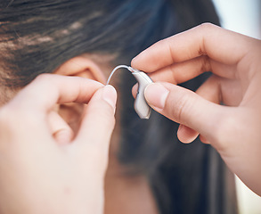 Image showing Closeup, hands and hearing aid support for person, listening help and medical gear. Healthcare, woman with a disability and audio health, clinic innovation and device for sound waves or communication