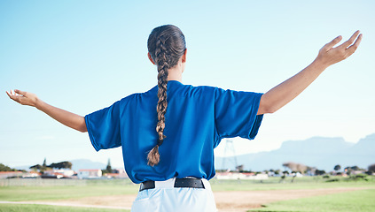 Image showing Woman, arms raised and winner with cheers, softball and sports with athlete on outdoor pitch and back view. Pray, hope and freedom, celebration and exercise, baseball player and winning competition