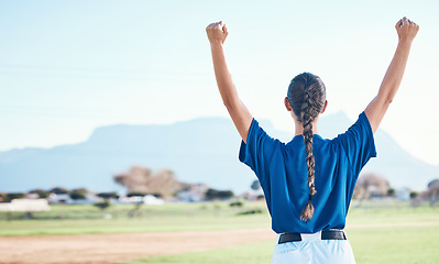 Image showing Woman, fist pump and winning, softball and athlete on outdoor pitch, celebration and success with sports. Back view, baseball player and yes, fitness and achievement, cheers and competition winner