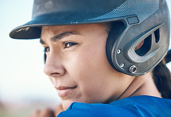 Image showing Baseball, face and a person with a helmet outdoor on pitch for sports performance or competition. Professional athlete or softball woman with commitment and fitness for game, training or exercise