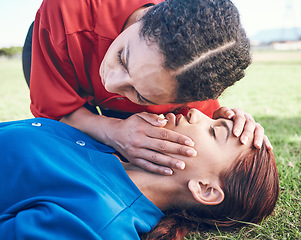 Image showing CPR, breathing check and woman on field for sport, fitness and game with accident and emergency. Training, paramedic and listening to lungs for breathe from injury with first aid and athlete outdoor