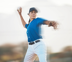 Image showing Baseball, ball and a woman pitching outdoor on a sports pitch for performance and competition. Professional athlete or softball pitcher with fitness for game, training or exercise on field or stadium