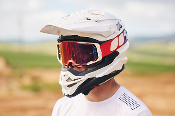 Image showing Sports, motorcycle and man with helmet in the countryside for fitness, practice or speed training. Motorbike, safety and male driver with head gear, protection and neon glasses for off road adventure