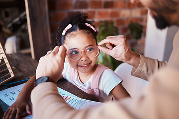 Image showing Glasses, smile and a child with a father and homework in a house with help and education. Happy, family and a father with eyewear for a girl kid during homeschool work, learning and teaching