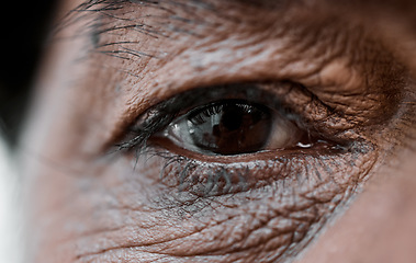 Image showing Eye, vision and wrinkles with a senior person closeup for sad emotion, pain or grief on an expressive face. Healthcare, depression or loss with an elderly adult looking nostalgic during retirement