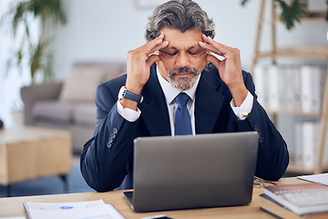 Image showing Stress, headache and businessman on a laptop in the office while working on a corporate project. Migraine, burnout and mature professional male lawyer doing research on a computer in the workplace.