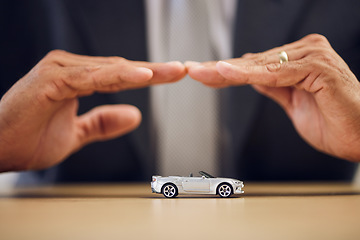 Image showing Desk, hands and a person with car insurance or covering for safety or business. Office, investment and a man with a shelter or security for transportation, guarantee or premium support for a vehicle