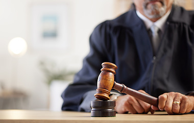 Image showing Closeup, hands and judge with a gavel of law, rule for order and attention to justice with legal hearing. Zoom, person and lawyer with a hammer, decision and auction with constitution in courtroom