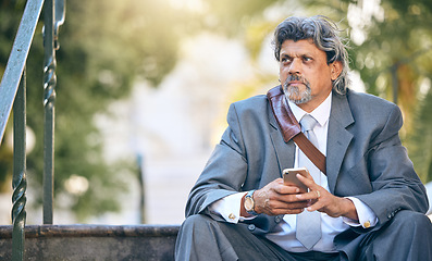 Image showing Phone, thinking and a business man on steps in the park during a work break for communication. Mobile, idea and mockup with a mature employee looking worried after job loss in a financial crisis