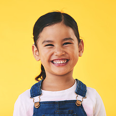 Image showing Happy, portrait and girl child with smile in studio for confidence, excited and positive attitude. Face, teeth and young kid from Mexico with happiness, pose and youth isolated on a yellow background