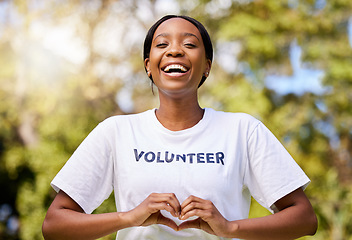 Image showing Heart, hands and African volunteer woman with sign for care, support and charity outdoor in nature, forest or environment. Show, love and happy person helping in community or service with empathy