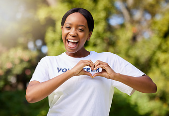 Image showing Heart, hands and portrait of volunteer woman with sign for care, support and charity outdoor in nature, forest or environment. Show, love and happy person volunteering in community service in empathy