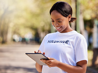 Image showing Woman, tablet and volunteering in park on social media FAQ, blog or community service website. African person on digital technology for earth day information, NGO or nonprofit sign up in nature