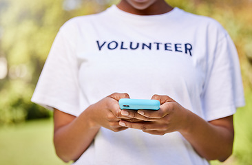 Image showing Person hands, phone typing and volunteering in park with social media FAQ, blog or community service chat. Volunteer on search mobile for earth day communication, NGO or nonprofit contact in nature