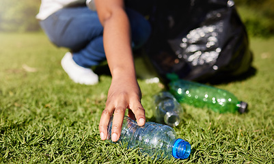 Image showing Volunteer, hands and plastic or cleaning park, community service and recycling for climate change or earth day project. Person volunteering in garden or grass with eco friendly action, bottle and bag