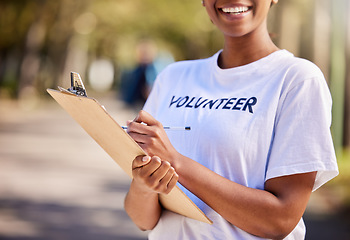 Image showing Woman, hands and volunteering checklist in nature for climate change, inspection and community service. Happy person writing on clipboard for earth day, NGO registration or nonprofit sign up in park
