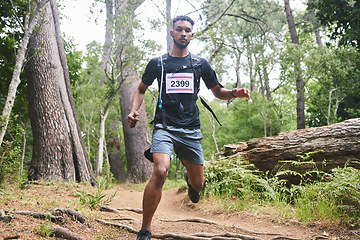 Image showing Running, fitness and man in nature for exercise, marathon training and cardio workout. Sports, nature and athlete in woods for wellness, healthy body and endurance for race, challenge and competition