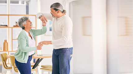 Image showing Mature couple, dancing and happy at home for anniversary, birthday or valentines celebration. Laugh, love and care of a man and woman for healthy marriage, happiness and romance with mockup space