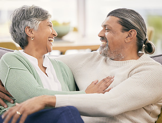 Image showing Mature couple, hug and smile on sofa in home for love, care and laugh together with marriage partner. Happy man, woman and embrace on couch in living room for trust, relax and support of relationship