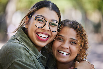 Image showing Smile, portrait and women hug at a park outdoor for weekend, bonding or hanging out or having fun together. Happy, face and female friends embrace, excited and cheerful for reunion, trip or vacation