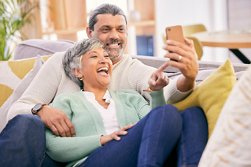 Image showing Mature couple, laugh and phone in home of social media post, meme or mobile app subscription. Happy man, woman and reading funny joke on internet, scroll on smartphone or relax on sofa in living room