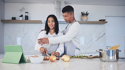 Image showing Digital tablet, cooking and couple in a kitchen, talking and bonding with love, marriage and fun activity. Home, man and woman with tech, online recipe and video with instructions and prepare a meal