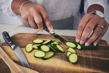 Image showing Cooking, food and hands with cucumber in kitchen on wooden board for cutting, meal prep and nutrition. Healthy diet, ingredients and person with vegetables for vegetarian dinner, lunch and salad