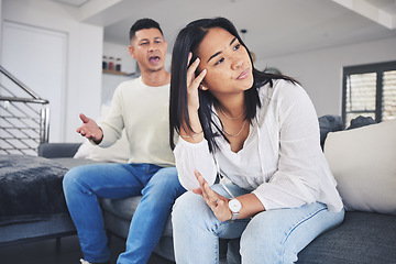 Image showing Frustrated couple, headache and argument in divorce, conflict or disagreement on living room sofa at home. Unhappy man and woman in breakup, cheating affair or fight from toxic relationship in house