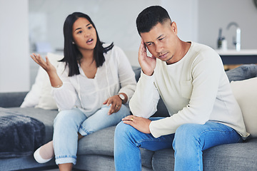 Image showing Frustrated couple, headache and disagreement in divorce, conflict or argument on living room sofa at home. Unhappy man and woman in breakup, cheating affair or fight from toxic relationship in house
