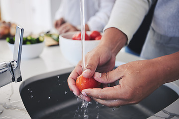 Image showing Water, tomato and hands cleaning vegetable for cooking in a kitchen basin or sink in a home for hygiene as a chef. Salad, food and person prepare produce for a supper, lunch or dinner for diet meal