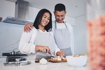 Image showing Hug, cooking and love with couple in kitchen for food, health and lunch recipe. Happy, nutrition and dinner with man and woman cutting vegetables at home for diet, wellness and romance together