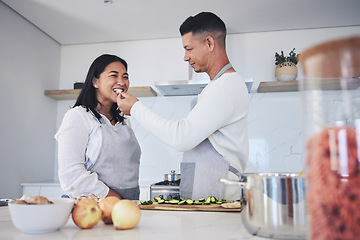 Image showing Feeding, cooking and love with couple in kitchen for food, health and lunch recipe. Happy, nutrition and dinner with man and woman cutting vegetables at home for diet, wellness and romance together