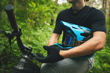 Image showing Mountain bike, man and helmet, glove in forest and sports, adventure and fitness in nature outdoor. Cycling, biker and travel with athlete, exercise training and ready to ride, bicycle and challenge