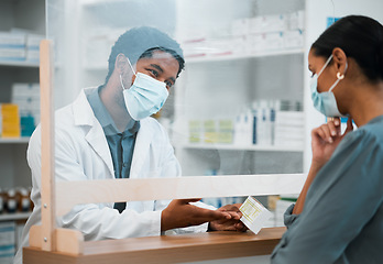 Image showing Pharmacy, face mask or black man giving pills to woman patient in customer service for wellness advice. Healthcare help, African pharmacist or doctor with pharmaceutical medicine or medical product