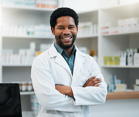 Image showing Pharmacist, black man and arms crossed for healthcare, medicine and clinic solution, service and support. Happy portrait of medical worker in pharmacy for drugs, product inventory and retail mindset