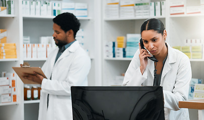 Image showing Phone call, counter and pharmacy woman for medicine, conversation and virtual healthcare support. Employee, medical person or pharmacist for checklist, computer and telephone with customer service