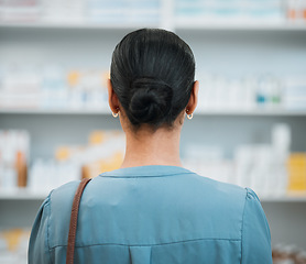 Image showing Back, woman and patient in pharmacy, drugs and health with prescription and customer with pill choice. Healthcare, medicine and pharmaceutical medication with shopping, treatment and medical service