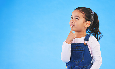 Image showing Thinking, child and girl with ideas, solution and question with doubt on a blue studio background. Mockup space, kid or model with planning, choice and inspiration with problem solving or opportunity
