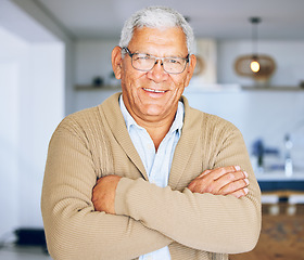 Image showing Senior man, portrait and retirement house with arms crossed and smile from elderly care. Confidence, relax and living room room with male person from Mexico with glasses and happy in a old age home