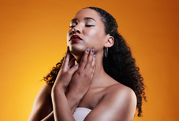 Image showing Beauty, makeup and curly hair with face of woman in studio for texture, fashion and cosmetics. Self care, salon and hairstyle with model on orange background for skincare, spa treatment and mockup