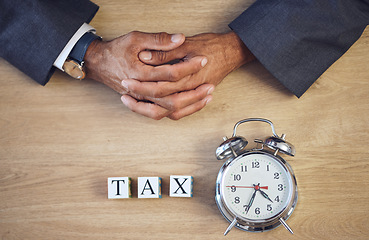 Image showing Taxes, clock and hands of person with building blocks on table from above for planning, future and investment. Budget, payment and accounting with alarm for time, income and economy mockup space