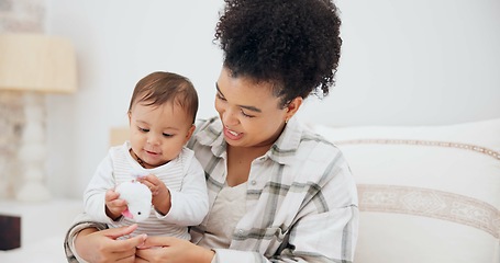 Image showing Toy, mother and child or baby for development, learning and growth in family home. Cute toddler or infant kid with woman or parent for love, care and security while playing for mobility exercise