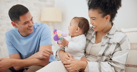 Image showing Couple, family and quality time with baby, mom and dad playing with toys for fun, laughing together in home, bedroom or nursery. Newborn, infant and happiness in motherhood, family or child smile